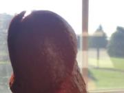 Jerking off in the sunlit window