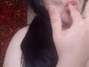 Sexy girl sucking fingers and imagining a huge cock in mouth