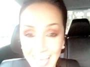 hot brunette talking and flashing in her car