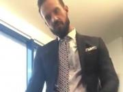 Suited daddy jerks in the office