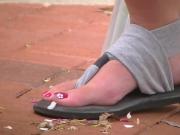 Cute brunette's feet outside the Union