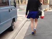 Wind blows up Japanese girl's skirt