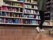 DW Auburn teen with green coat in make-up aisle