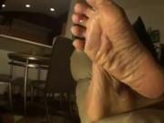Mature Wrinkled Soles On The Sofa