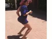 Dancing girl in a tight blue dress