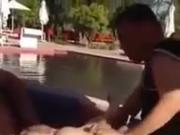 Moroccan slut massaged and groped by two guys by the pool