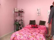 Dava and Lily Cade have fun on a pink bed