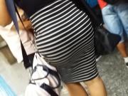 Hot ass in striped skirt