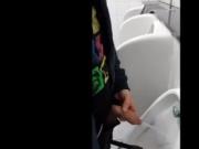Lad with a nice uncut cock pissing at the urinals