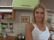 Dirty blonde teen dines on some cock in the kitchen