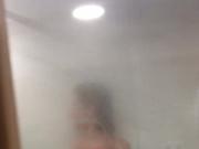 Slim wife takes a shower