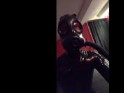 Black shiny rubber and a bit of breathplay