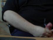 Me cumming on my shirt covered belly.