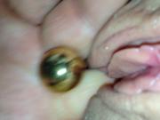 Eating her out with balls in her pussy