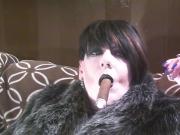 Fur and a cigar.