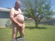 Naked old man outside flashing an pissing