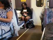 Ebony milf brown shiny legs on the train