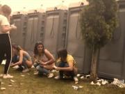 Girls pissing outdoor at Festival