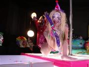 Clown Leya Falcon plays with a big purple dildo