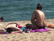 Shy girl takes bikini off at beach