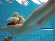Blonde in a dress in a pool