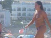 Topless mom walking