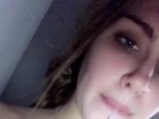 Showing off her mouth full of cum