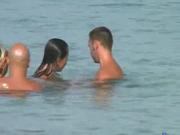 two swingers couples on the beach