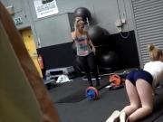 Girl in tight pants in gym