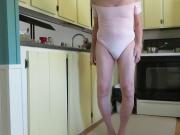 Male slut in a leotard shows his fem ass cheeks.