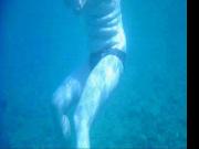 Topless thick MILF under the water for voyeurs