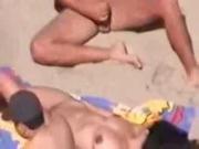 Two beach hand job with woman