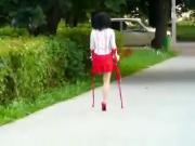 amputee girl wearing a single red heel