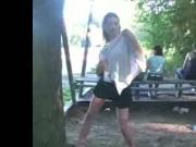 Teen flashing and stripping behind people