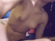 Hot Asian babe playing with a dildo