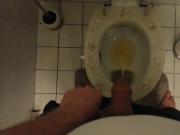 Pissing on toilet