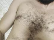 Hairy boy creaming own mouth, face and body