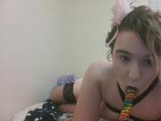 Kitten in Harness Bra licks Big Lollipop