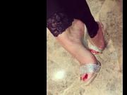 Beautiful feet with red nail polish