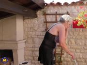 Busty grandma fucks her pussy