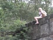 Girl empties her full bladder into the river Pee