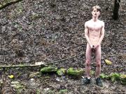 Naked cute boy playing with himself in the woods.