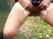 Stocking slut pissing outdoors