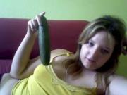 Ugly girl with a cucumber