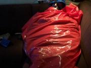 Bound and gagged in Raingear and blanket