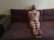 Tightly tape tied, gagged, blindfolded and naked