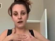 Busty white woman squeezes a big boob