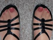 Pantyhose feet and toes in sandals.
