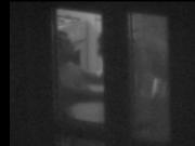 Couple caught through a window on spy cam