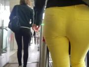 Horny ass of young MILF in yellow pants